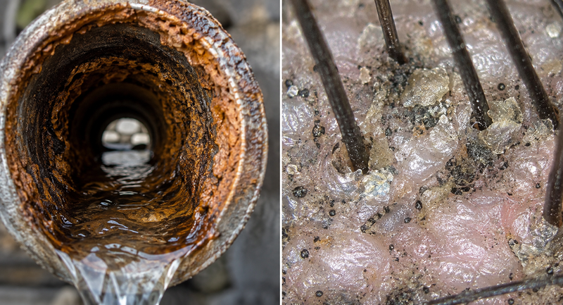 Verkalkte Wasserleitung und Duschkopf mit Kalkablagerungen