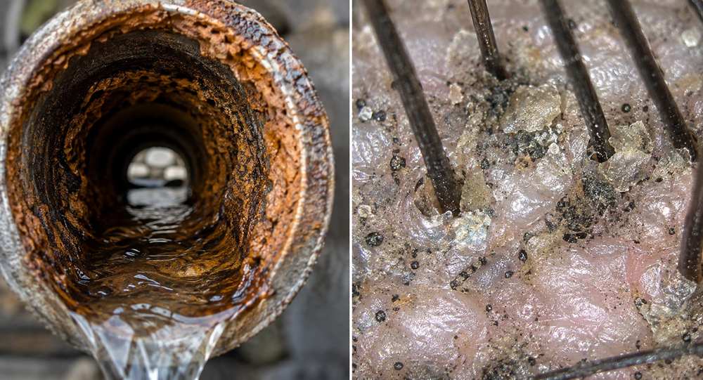 Verkalkte Wasserleitung und ein Duschkopf mit Kalkablagerungen